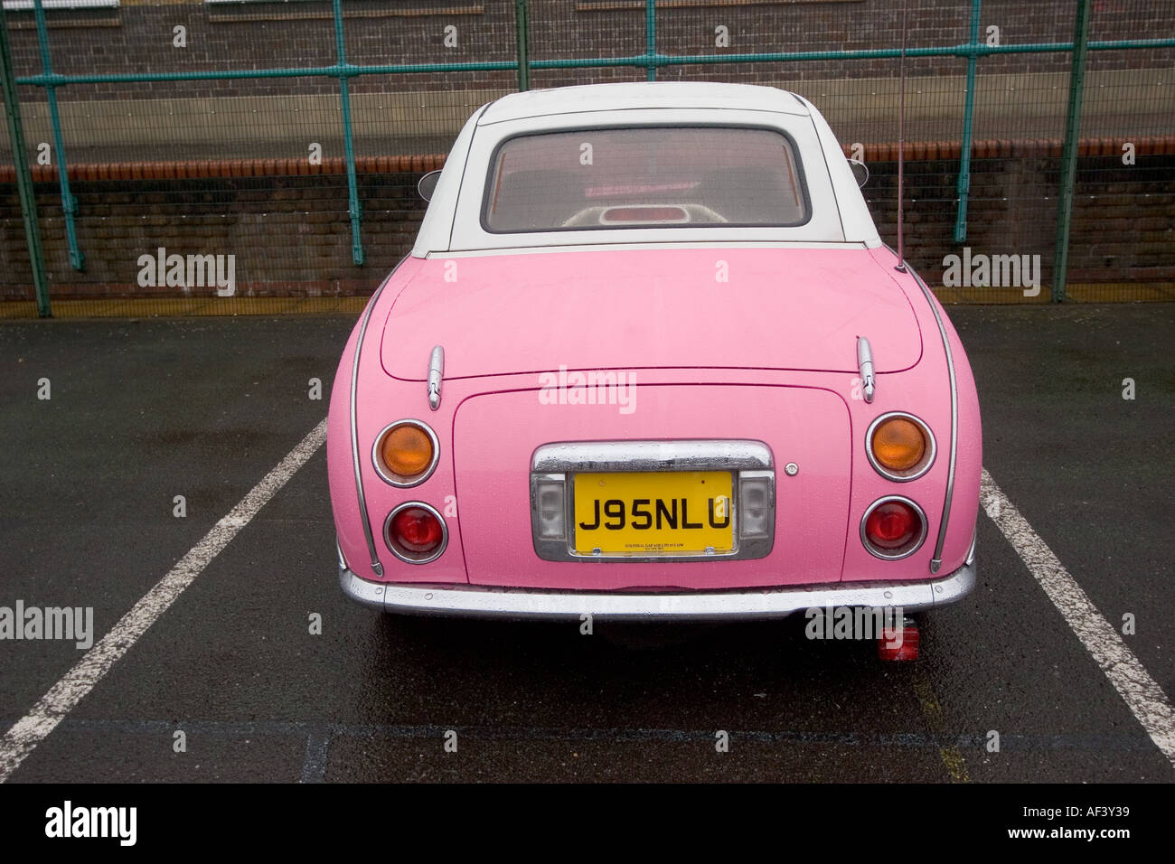 Pink and white two tone Nissan Figaro classic cult car japan Stock Photo