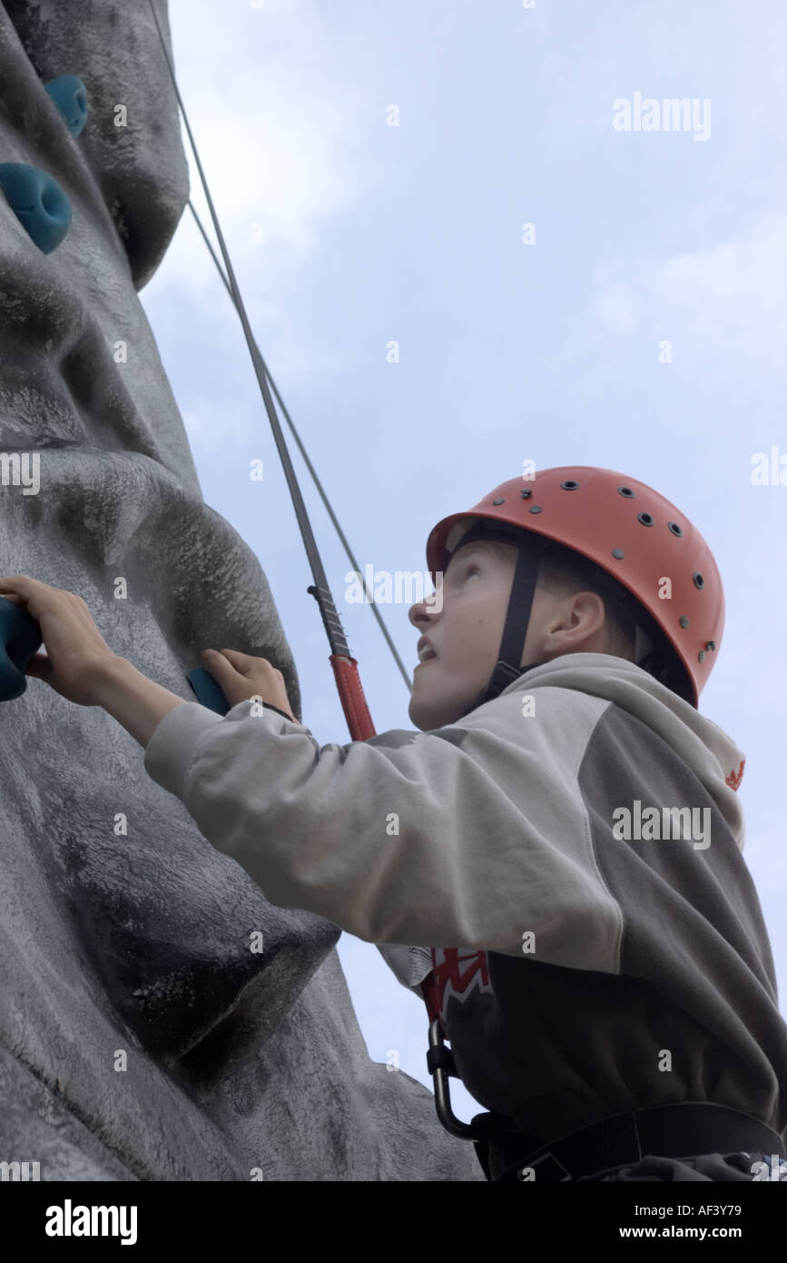 Boy climbing wall harness hi-res stock photography and images - Alamy