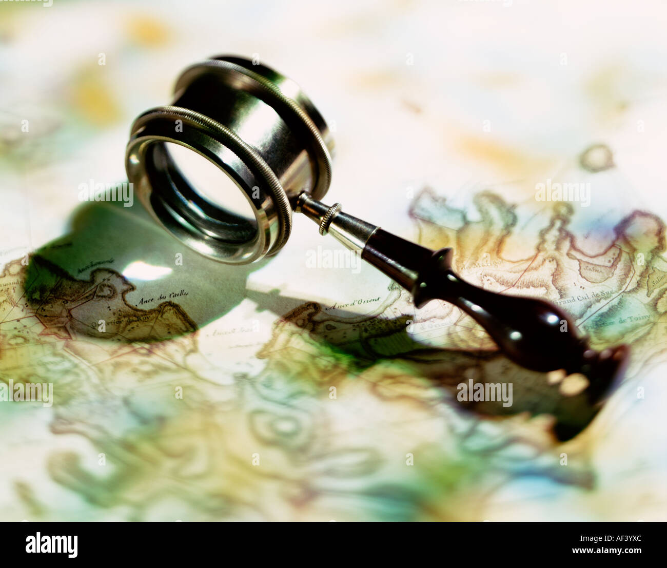 Antique magnifying glass Stock Photo