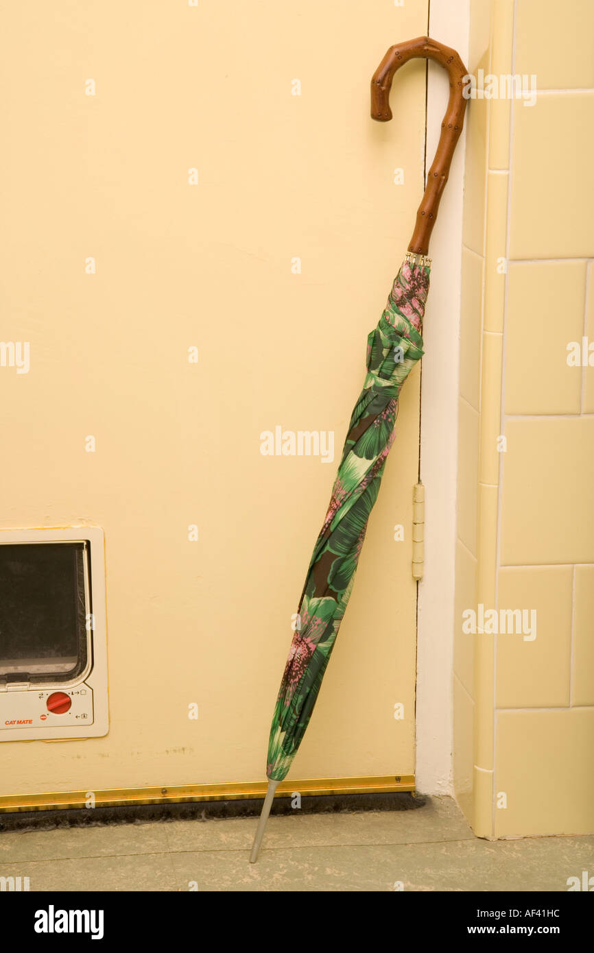 Umbrella Leaning against door Stock Photo Alamy