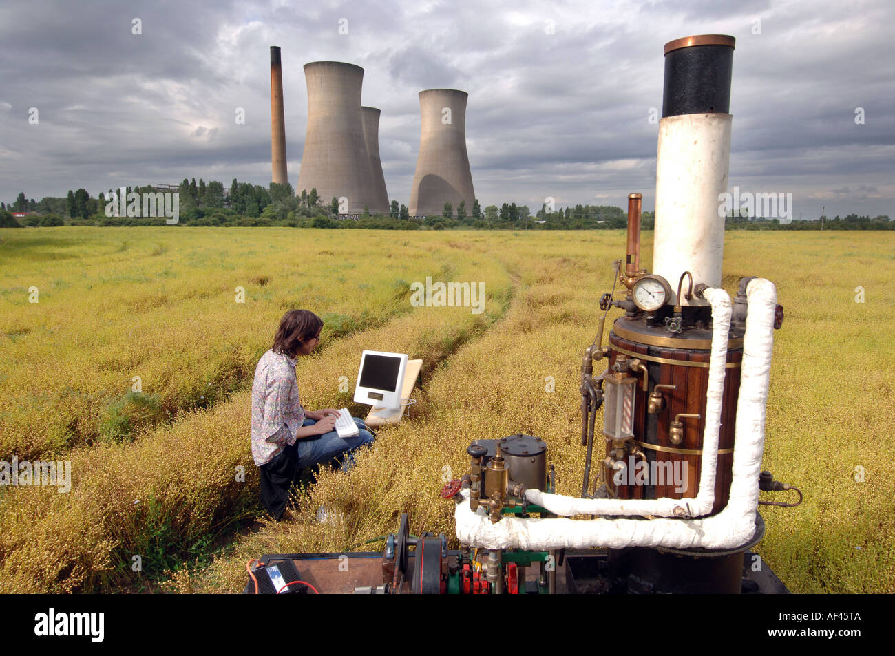 Crazy steam powered internet machine in Kent wheat field with Sandwich power station in background Stock Photo