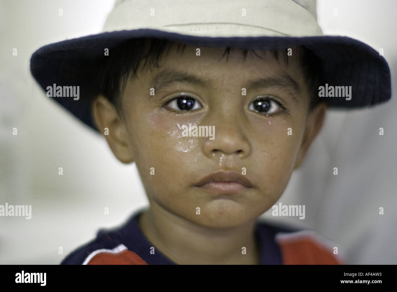 HONDURAS EL LIMON Young Honduran boy visiting a doctor for the first time cries in fear of the
