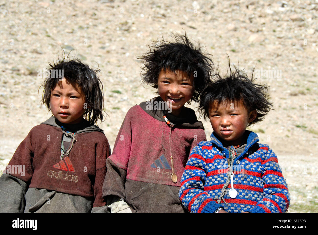 Nomads Tibetan boys with tousled hair Tibet China Stock Photo