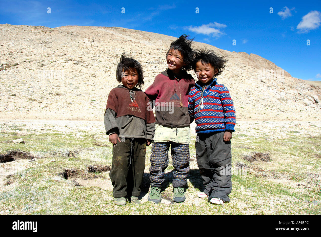 Nomads Tibetan boys with tousled hair Tibet China Stock Photo