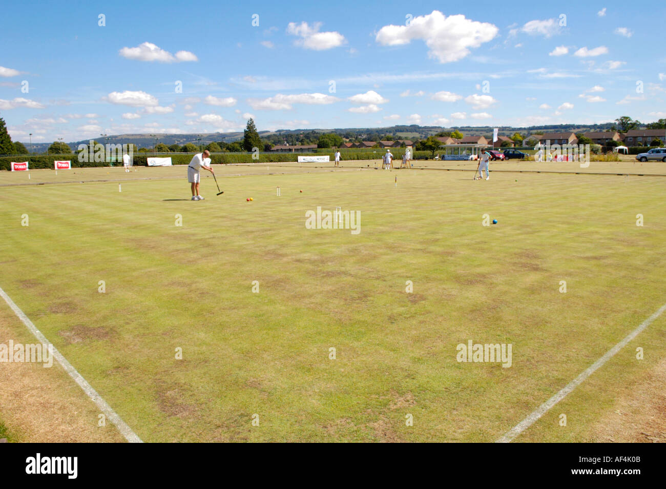 Croquet being played at Cheltenham Croquet Club Gloucestershire England