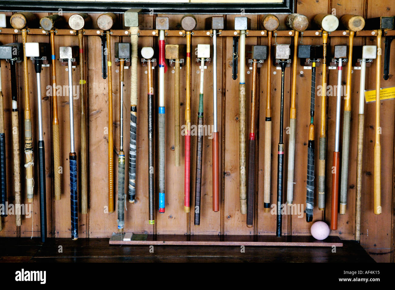 Croquet mallets hanging in a rack at Cheltenham Croquet Club