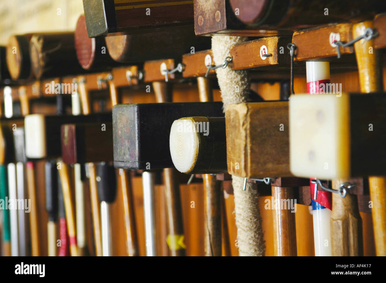 Croquet mallets hanging in a rack at Cheltenham Croquet Club