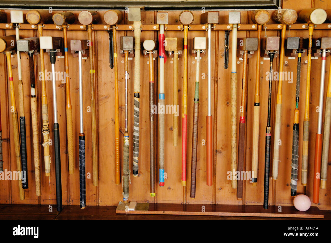 Croquet mallets hanging in a rack at Cheltenham Croquet Club