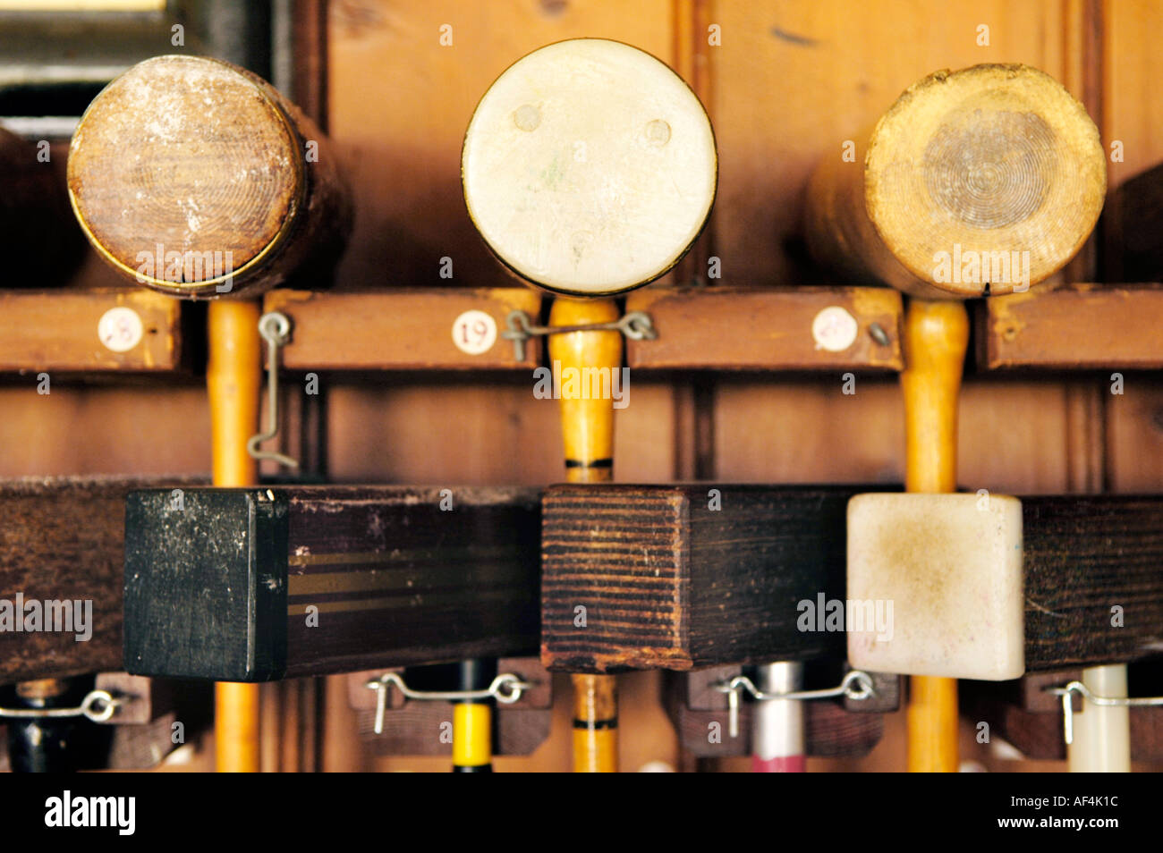 Croquet mallets hanging in a rack at Cheltenham Croquet Club