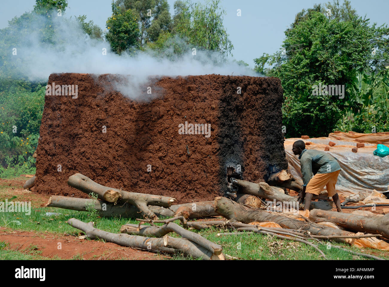 Bricks being baked and fired in Western Kenya at the side of the Kisumu Maseno road in Kenya East Africa Stock Photo