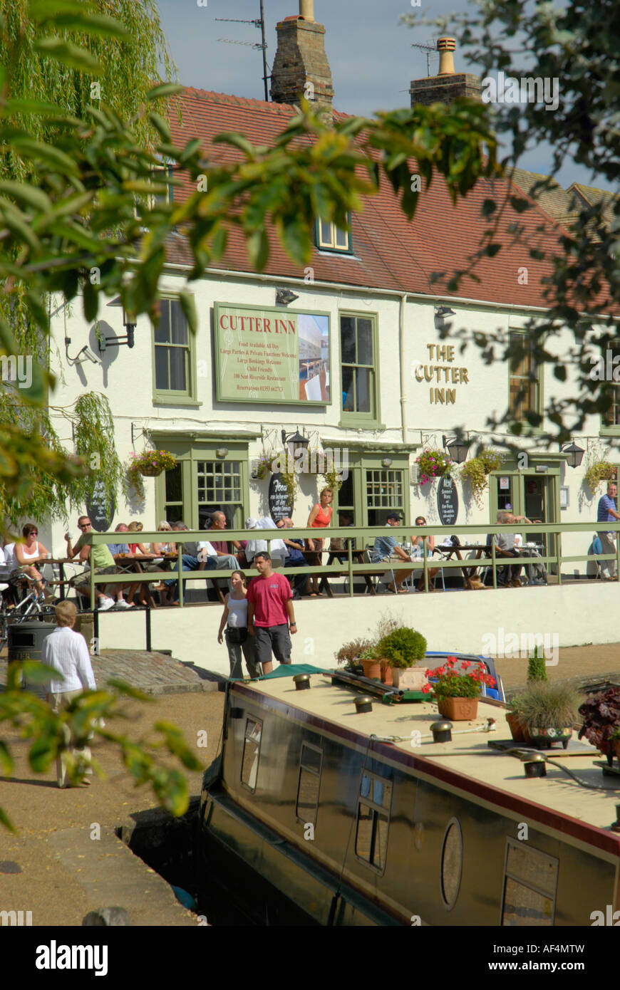 The Cutter Inn next to the River Great Ouse viewed through tree brances Ely Cambridgeshire England Stock Photo