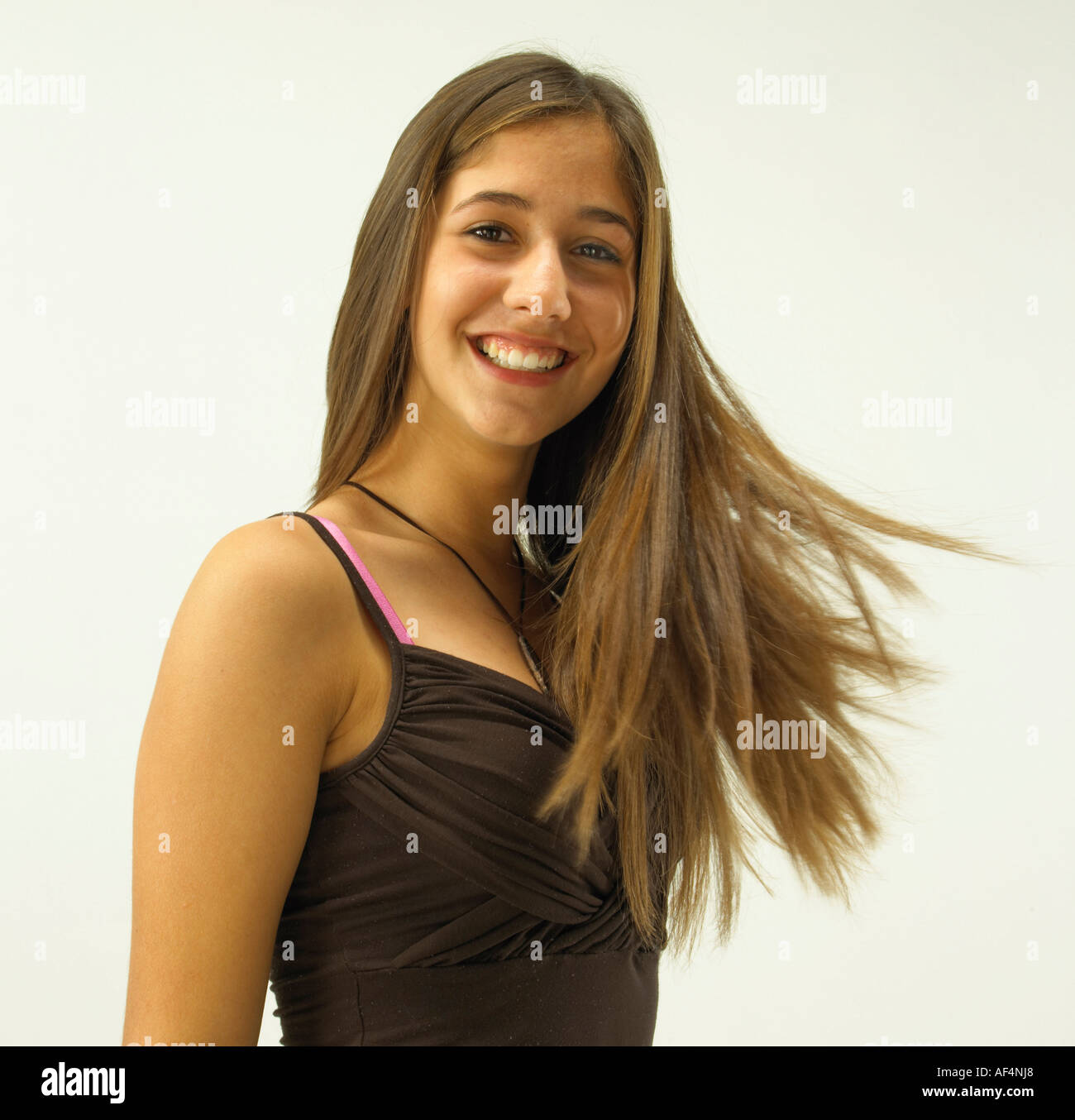 Happy teenager with long hair blowing Stock Photo