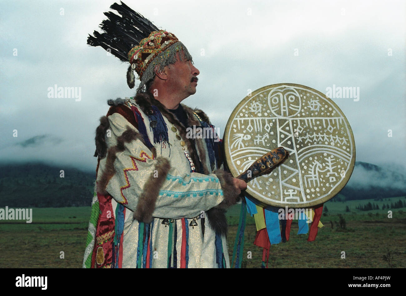 Shaman is performing ritual ceremony (kamlanie). El-Oiyn national festival of Altaic people. The Altai Republic. Russia Stock Photo