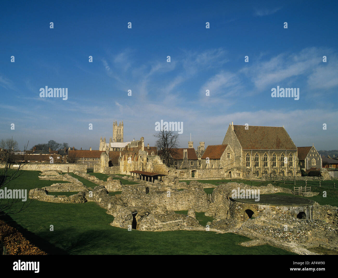 Ruins of St Auustine s Priory founded in 598 with Canterbury Cathedral in the distance Stock Photo