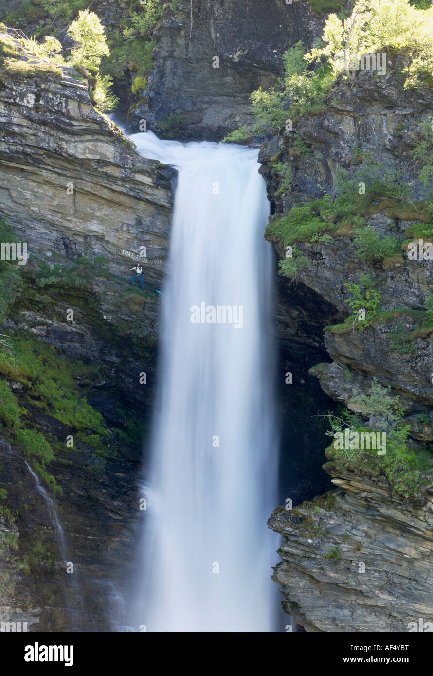 Walker beside Storseterfossen near Geiranger Stranda More