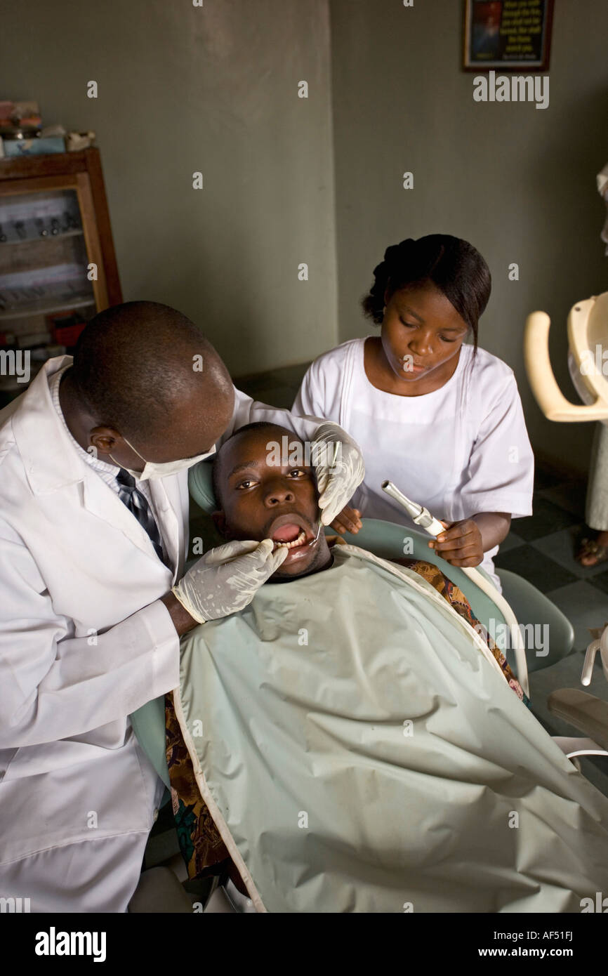 Nigeria Lagos, Dentist checking teeth of patient at dental clinic Stock