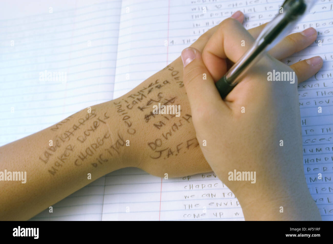 Closeup of a girl writing on her hand with a pen Stock Photo Alamy