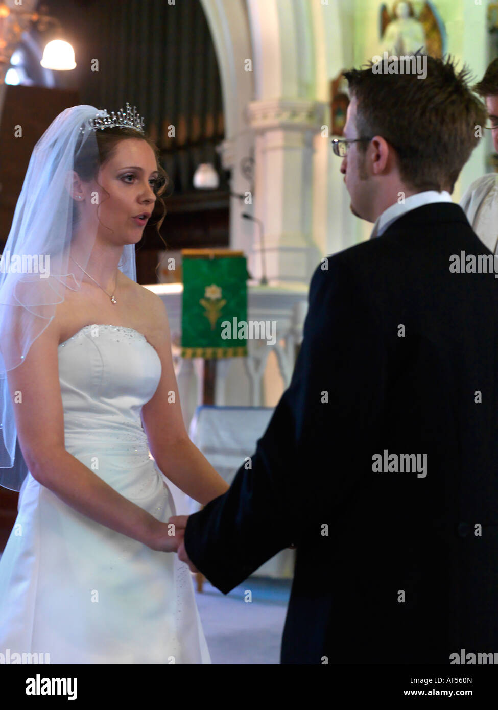 Bride & Groom Exchanging Vows During an Anglican Wedding Service Surrey England Stock Photo