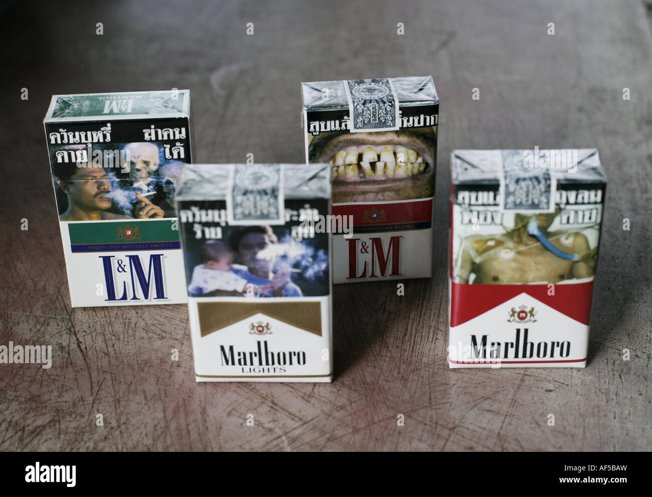 packages of  cigarettes with pictures of dead people, ill, cancer Stock Photo