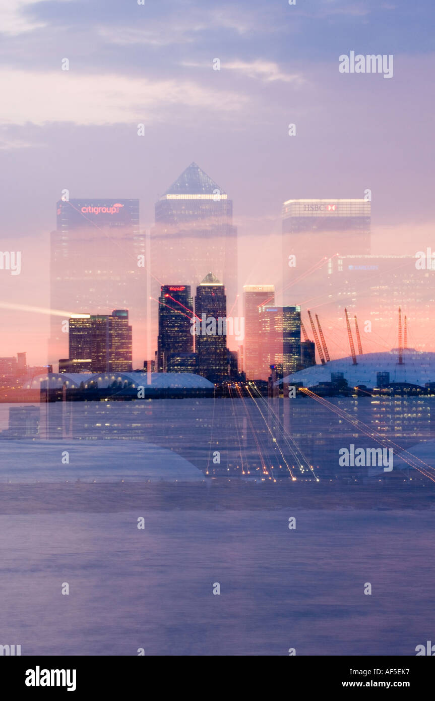 canary wharf skyline shot from across the river thames at night with a ...