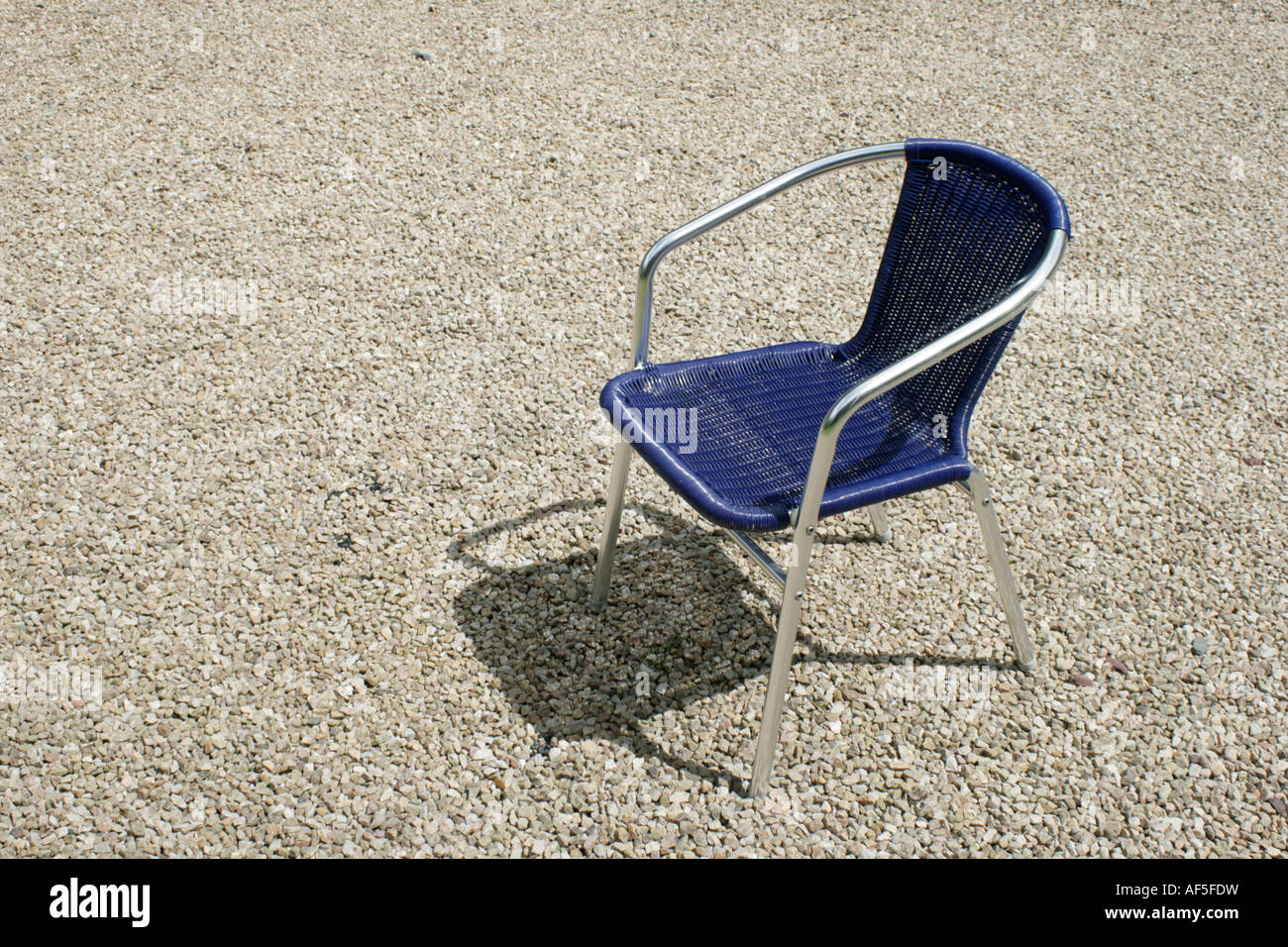 Sun chair on gravel driveway Stock Photo Alamy