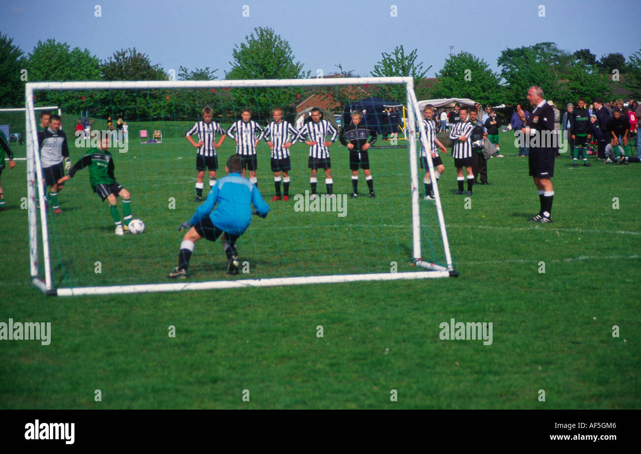 Children's football tournament. View of goalkeeper from behind the net