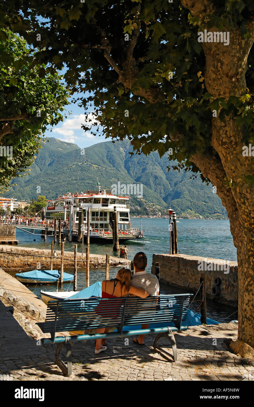 Switzerland Ticino Ascona Lago Maggiore Ferry pier couple on Stock Photo