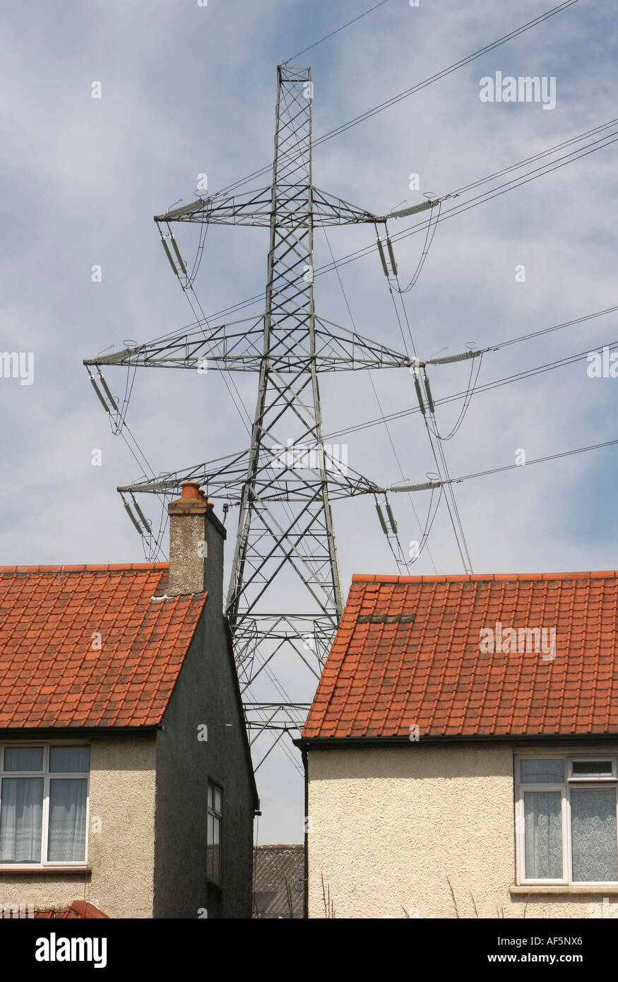 An electricity Pylon near houses, Croydon, Sutton, South London. Stock Photo