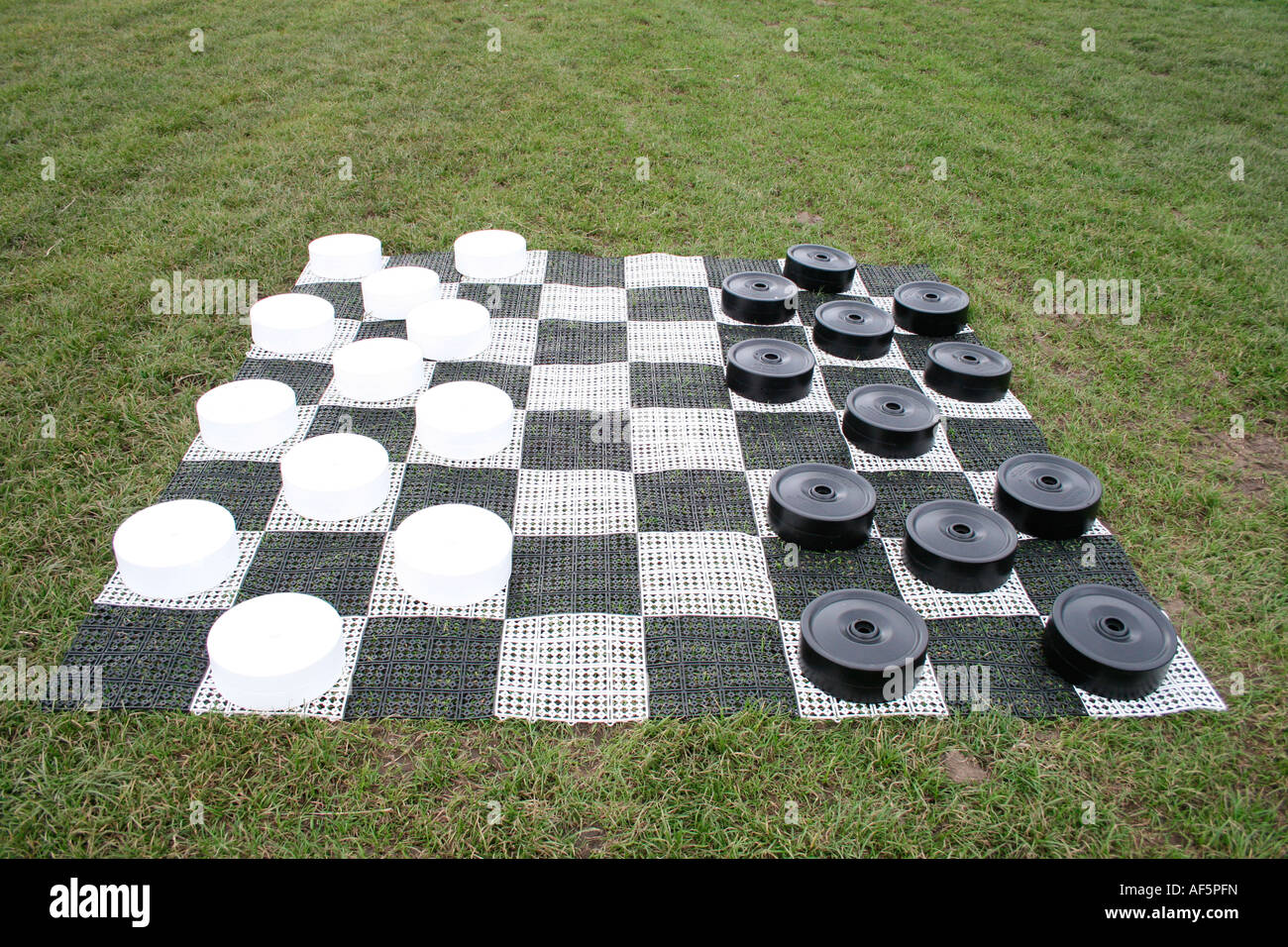 Grand Draft Giant game of drafts on grass pitch Stock Photo - Alamy