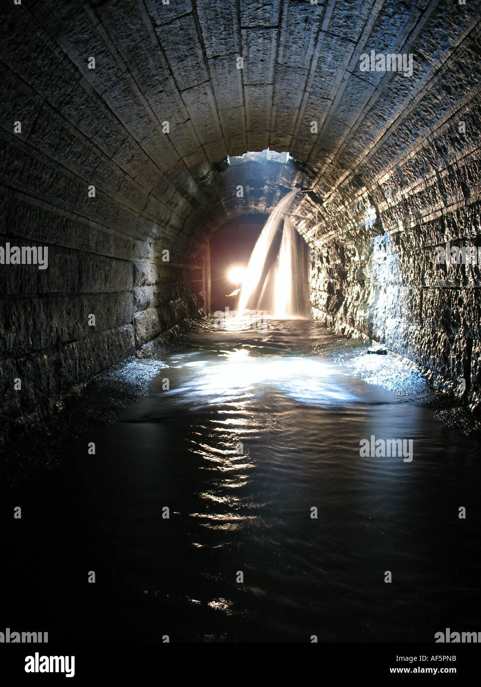 Underground Limestone Storm Drain Tunnel with Person Stock Photo Alamy