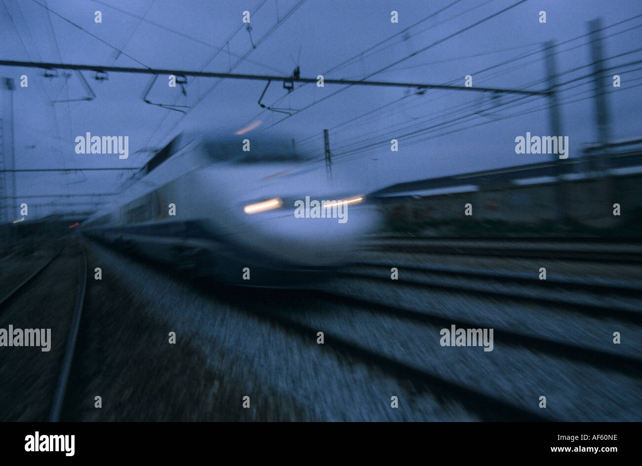 high speed travel train europe spain dusk Stock Photo