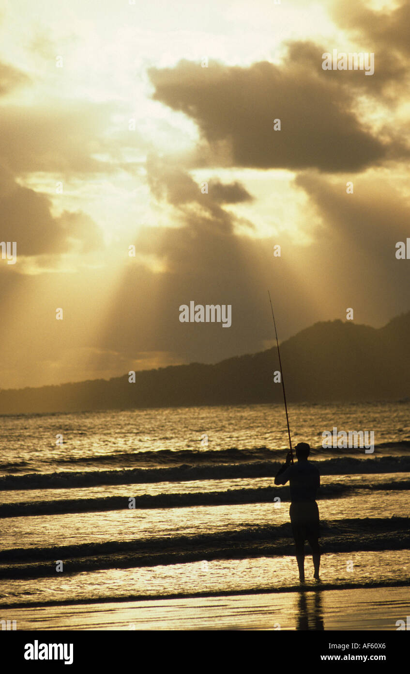 fisherman sea beach vertical silhouette Stock Photo - Alamy