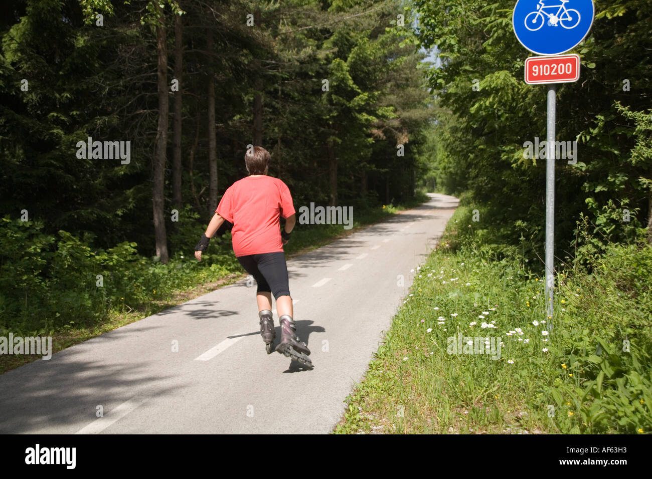 KRANJSKA GORA SLOVENIA EUROPEAN UNION June A woman roller blading along well maintained cycle route Stock Photo