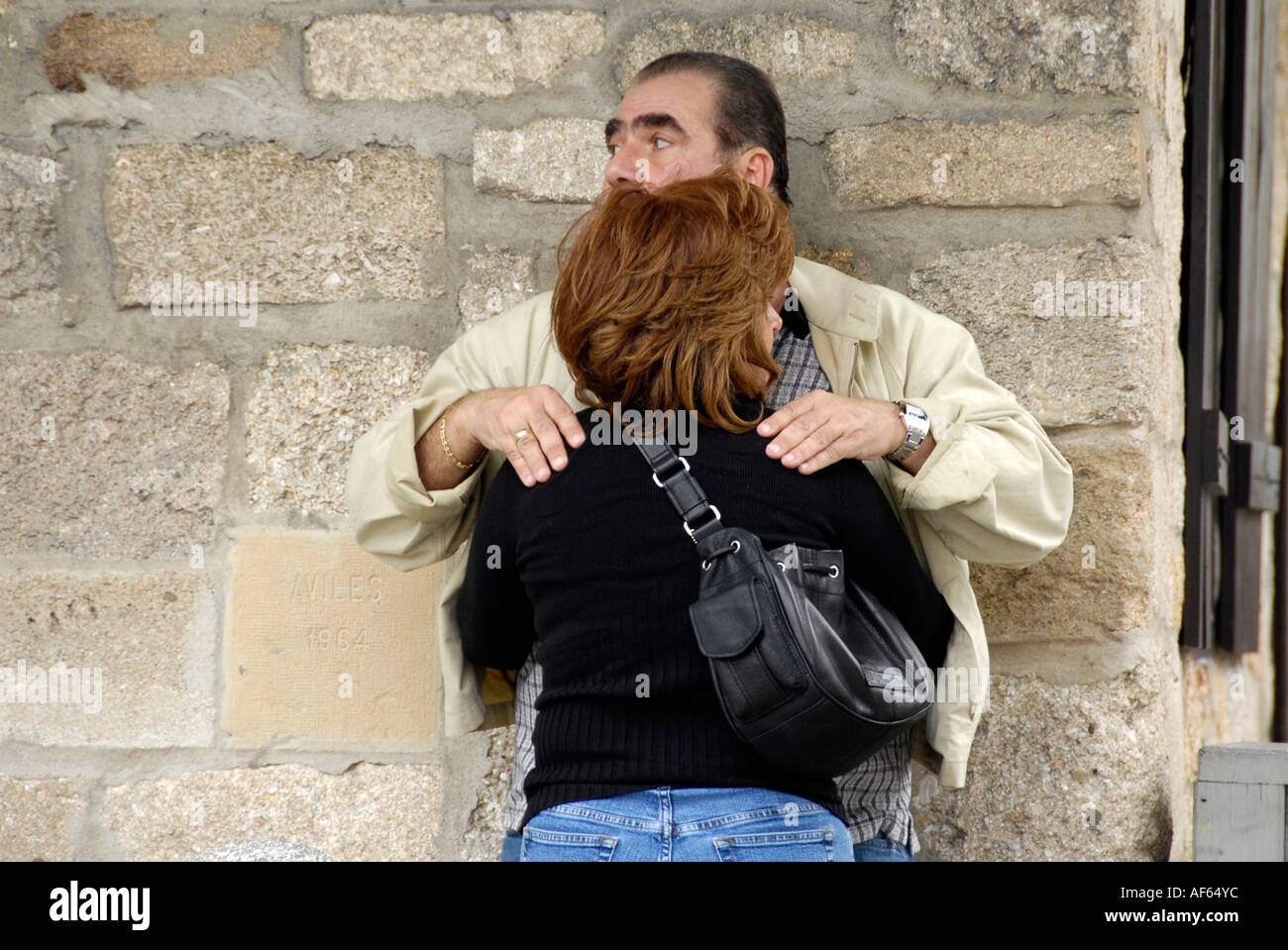 Man and woman display affection in public Stock Photo