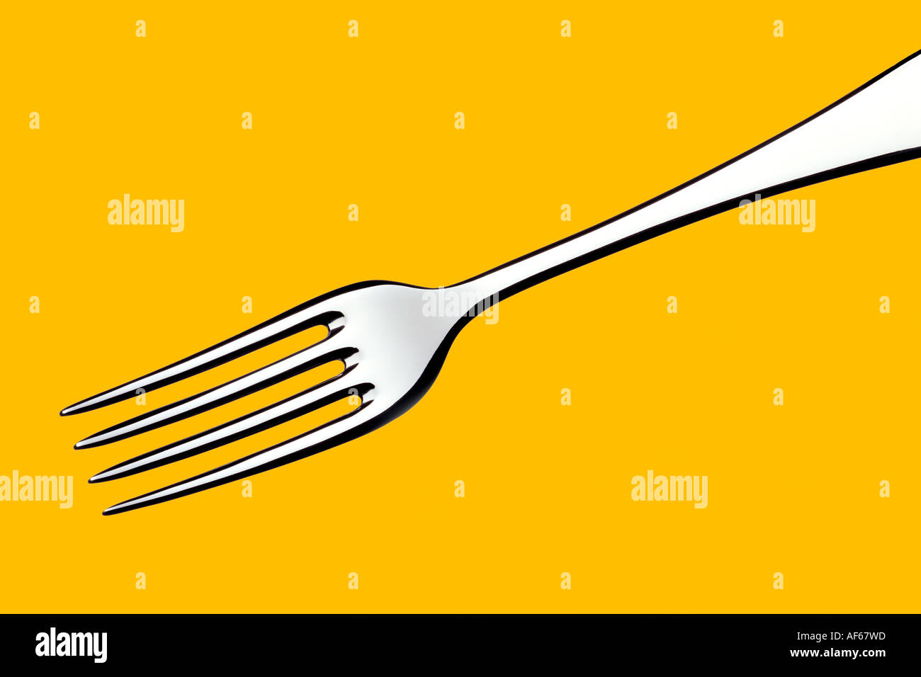 Fork Yellow Background Stock Photo