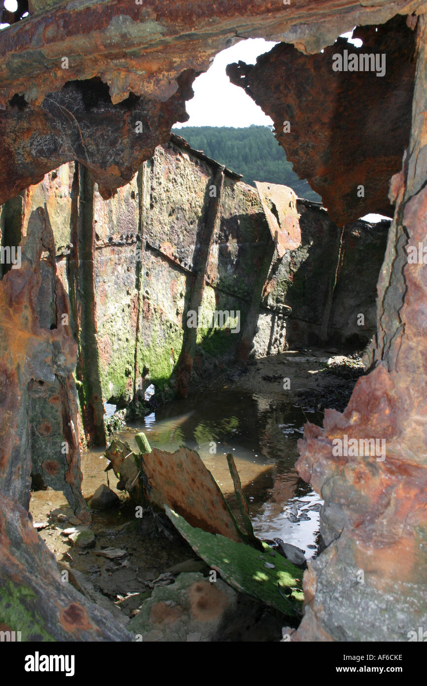 rusty and holed hull of barge wreck on Newry Canal near Victoria Lock, Newry Canal, County Down, Northern Ireland Stock Photo