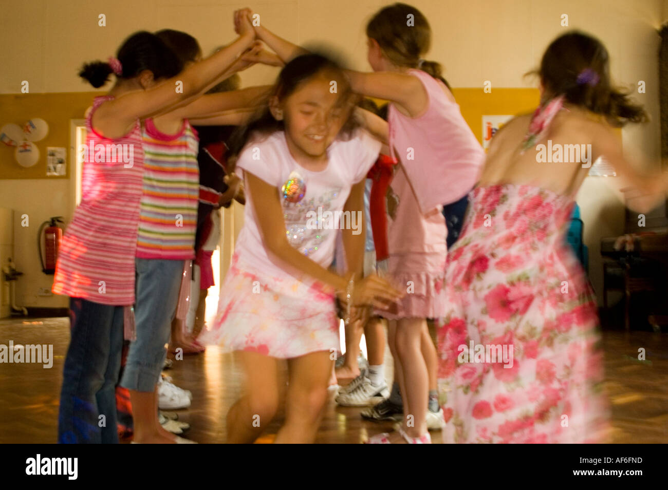 Horizontal Close Up Of Children Running Under An Arch Made From Arms Stock Photo Alamy