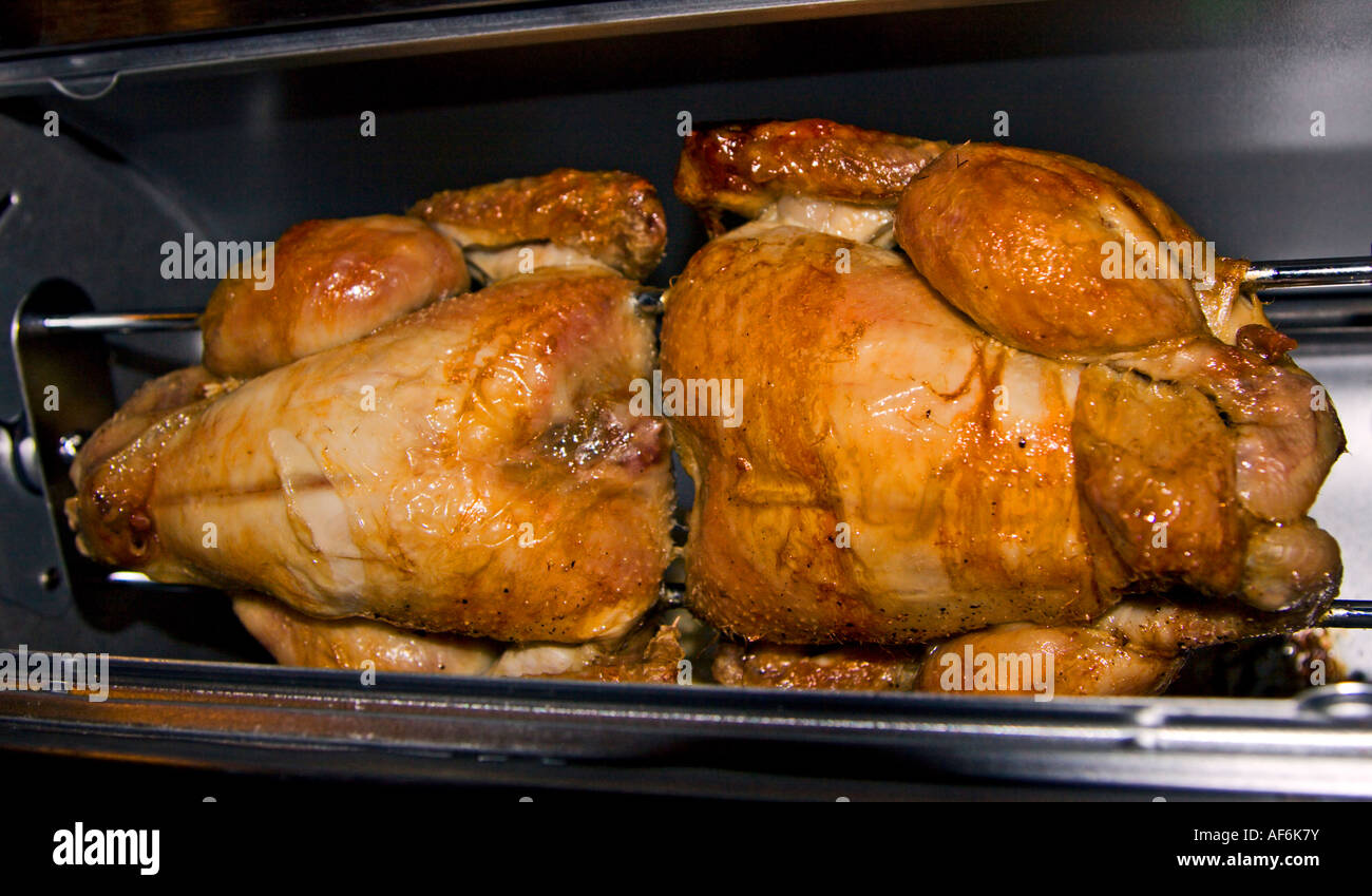 Spit-Roasting Poussin Stock Photo