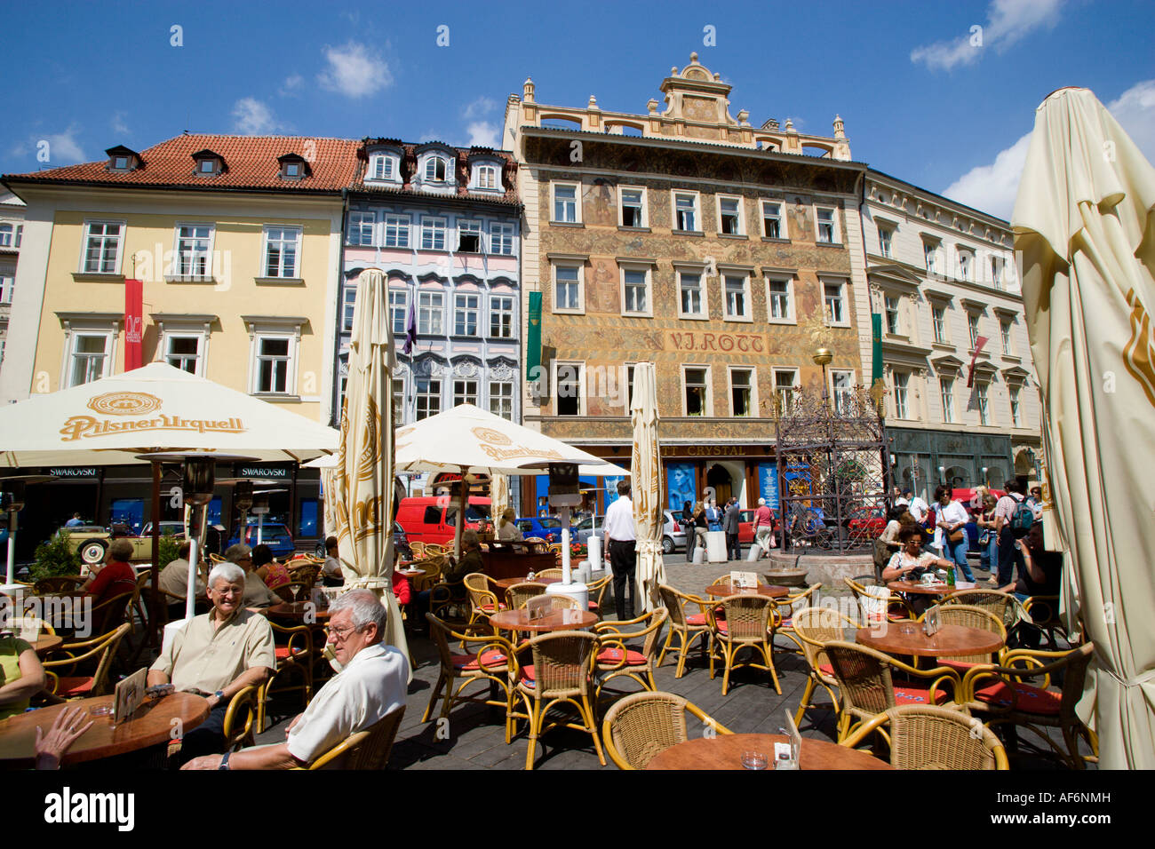 CZECH REPUBLIC Bohemia Prague Old Town People at tables with umbrellas at  street cafe in Namesti Square in front of Hotel Rott Stock Photo - Alamy