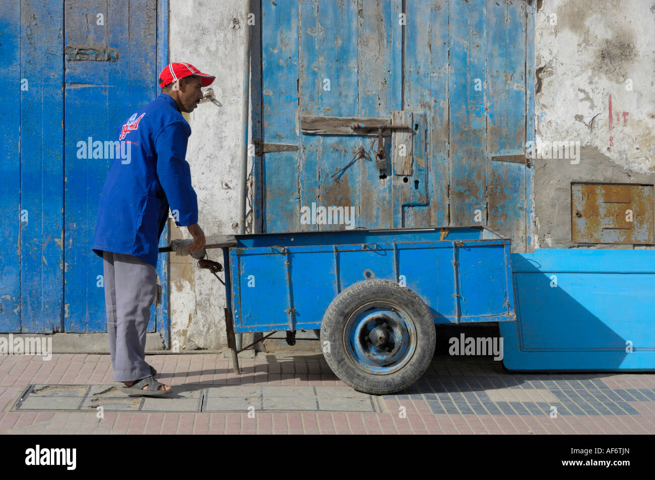 Porter attending to his cart Essaouira Morocco North Africa Stock Photo