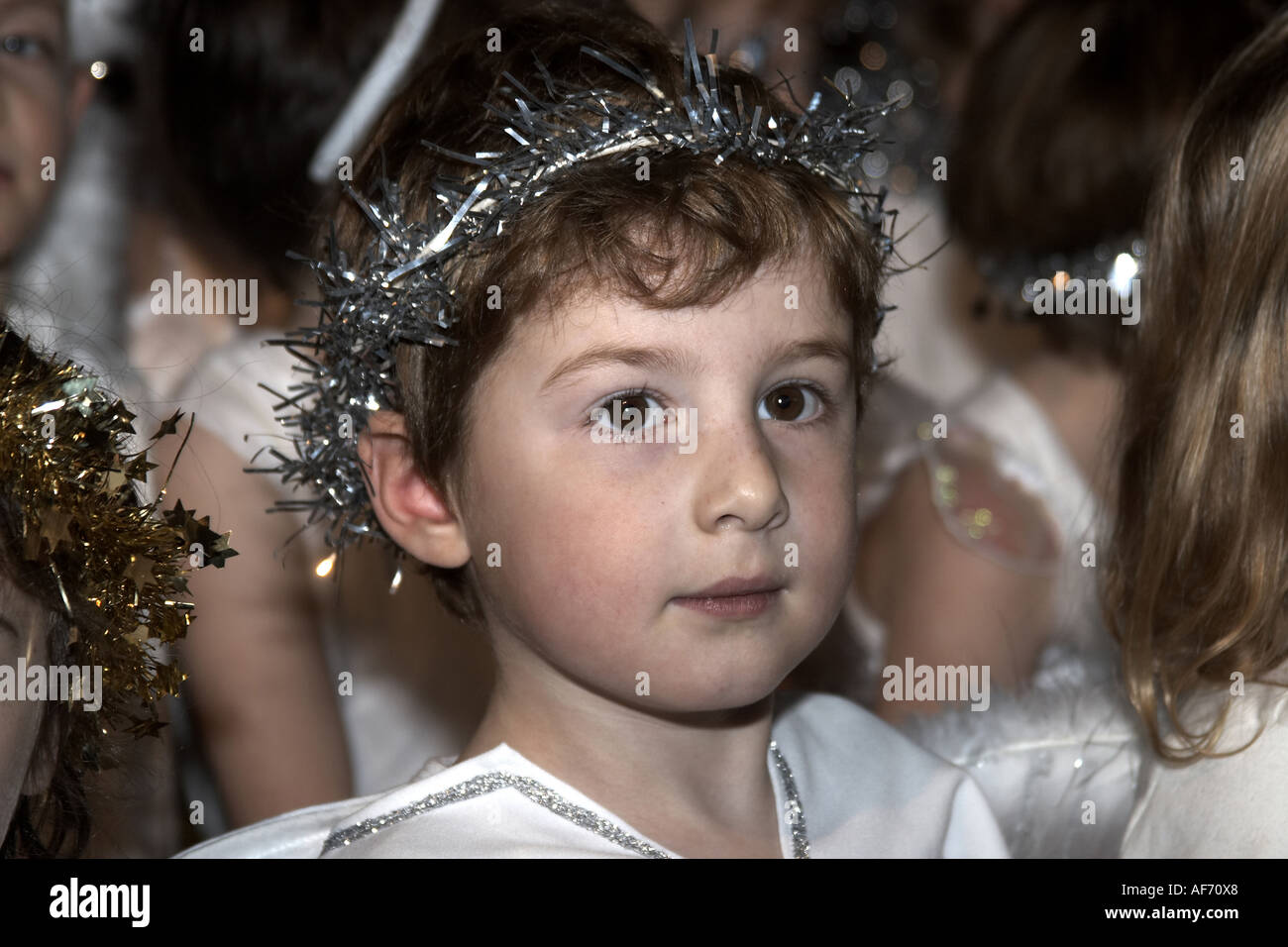 Attractive young boy child dressed as angel in primary school nativity play NAOH Stock Photo Alamy
