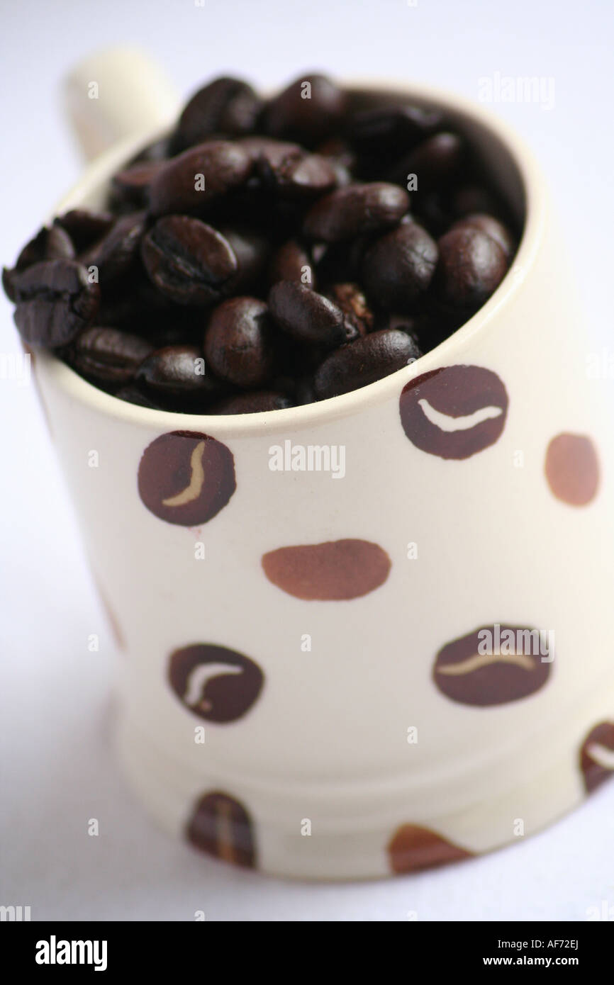 An Emma Bridgewater Espresso Cup Filled with Coffee Beans Stock Photo