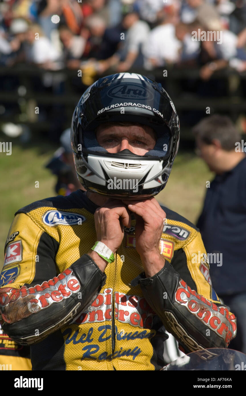 Guy Martin motorcycle racer and TV personality fastening his helmet on the start line Stock Photo