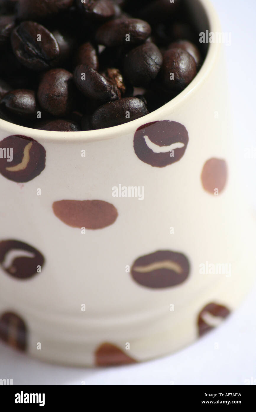 An Emma Bridgewater Espresso Cup Filled with Coffee Beans Stock Photo