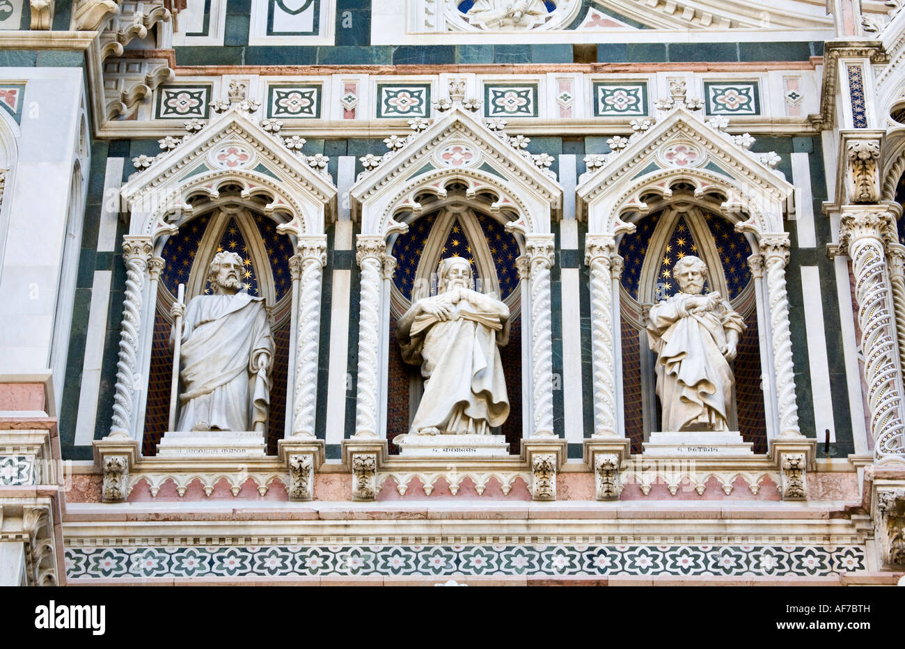 Religious statues on the main facade of Santa Maria del Fiore cathedral (Duomo) Florence, Italy Stock Photo