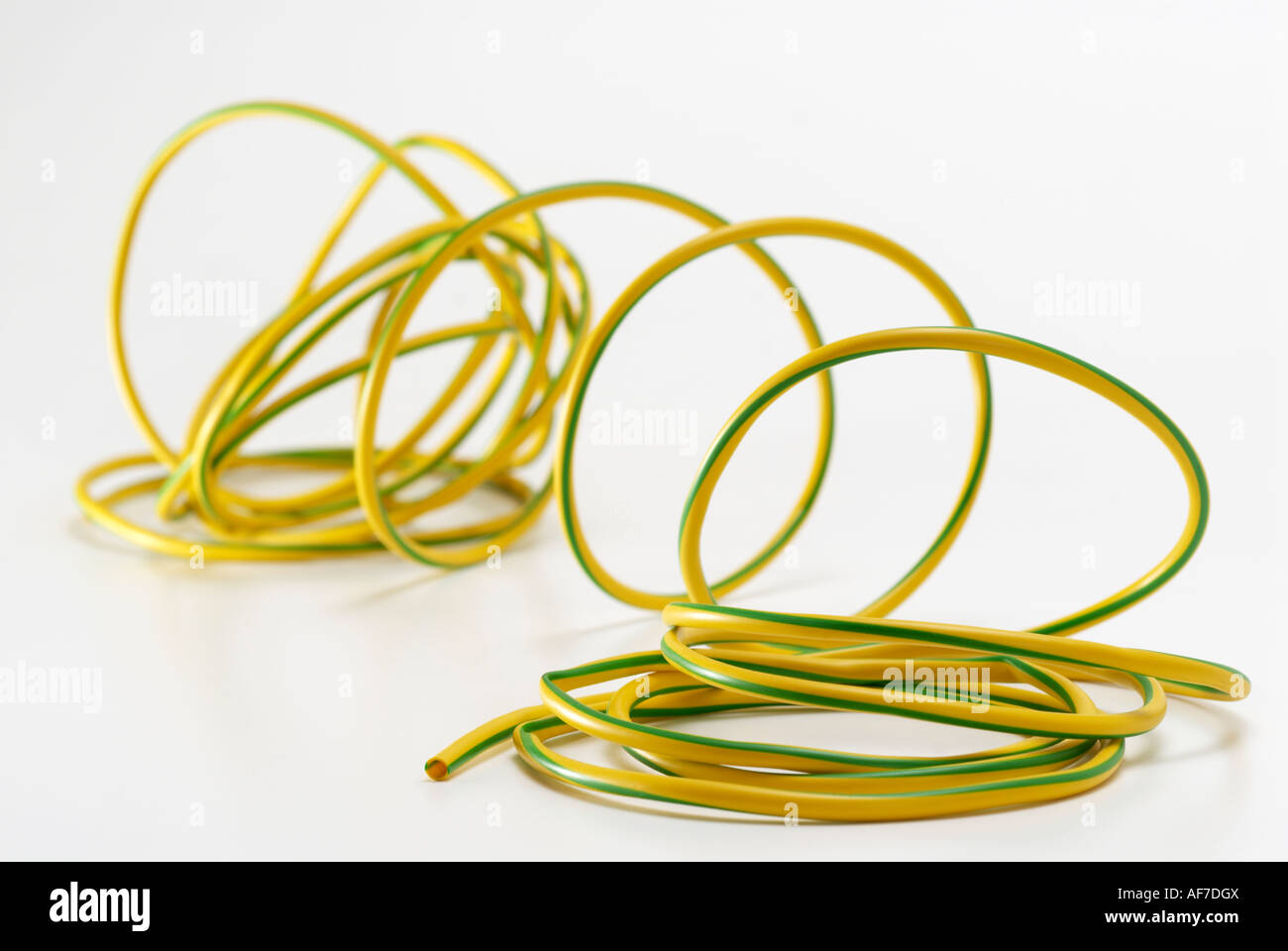 Plastic Yellow and Green domestic electricity' earthing cable' sleeving Stock Photo