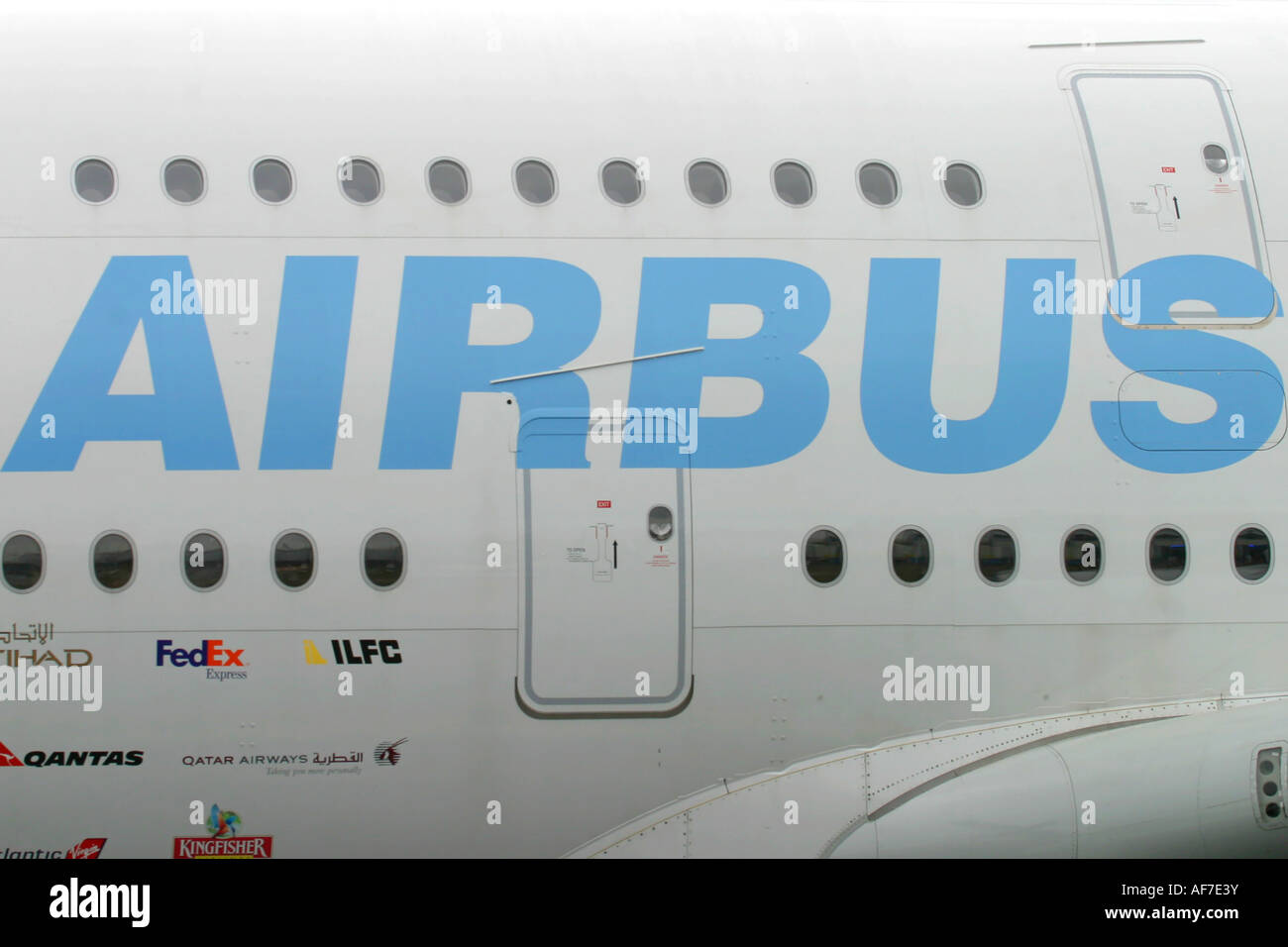 Sign Airbus on the fuselage of largest passenger jet aeroplane A380 Stock Photo