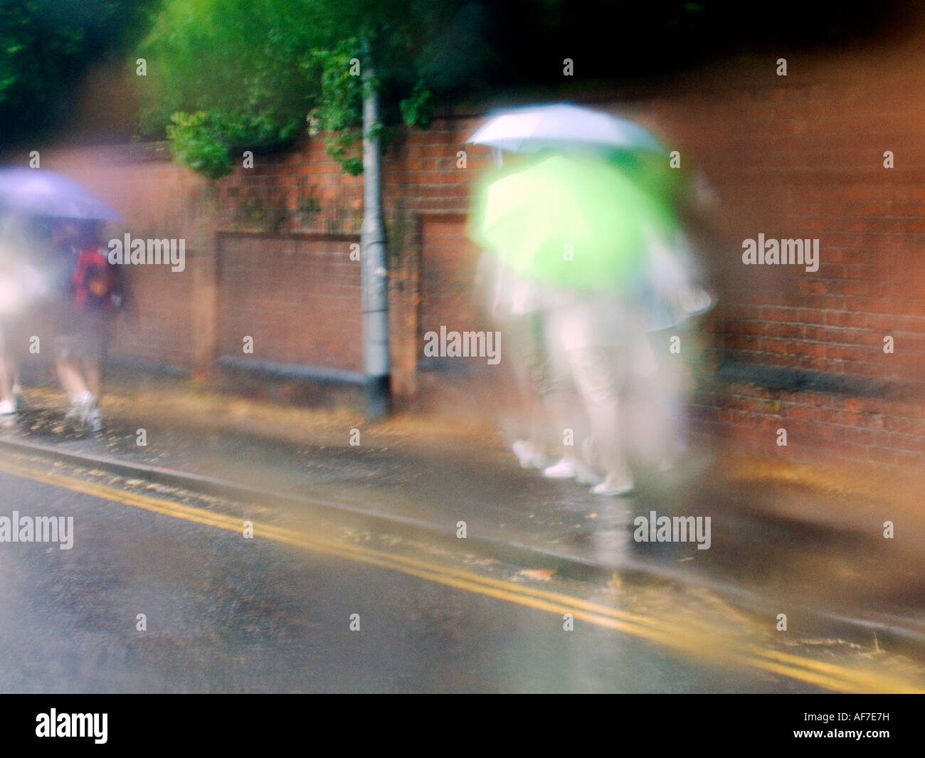 Pedestrian carrying umbrella hi-res stock photography and images - Alamy