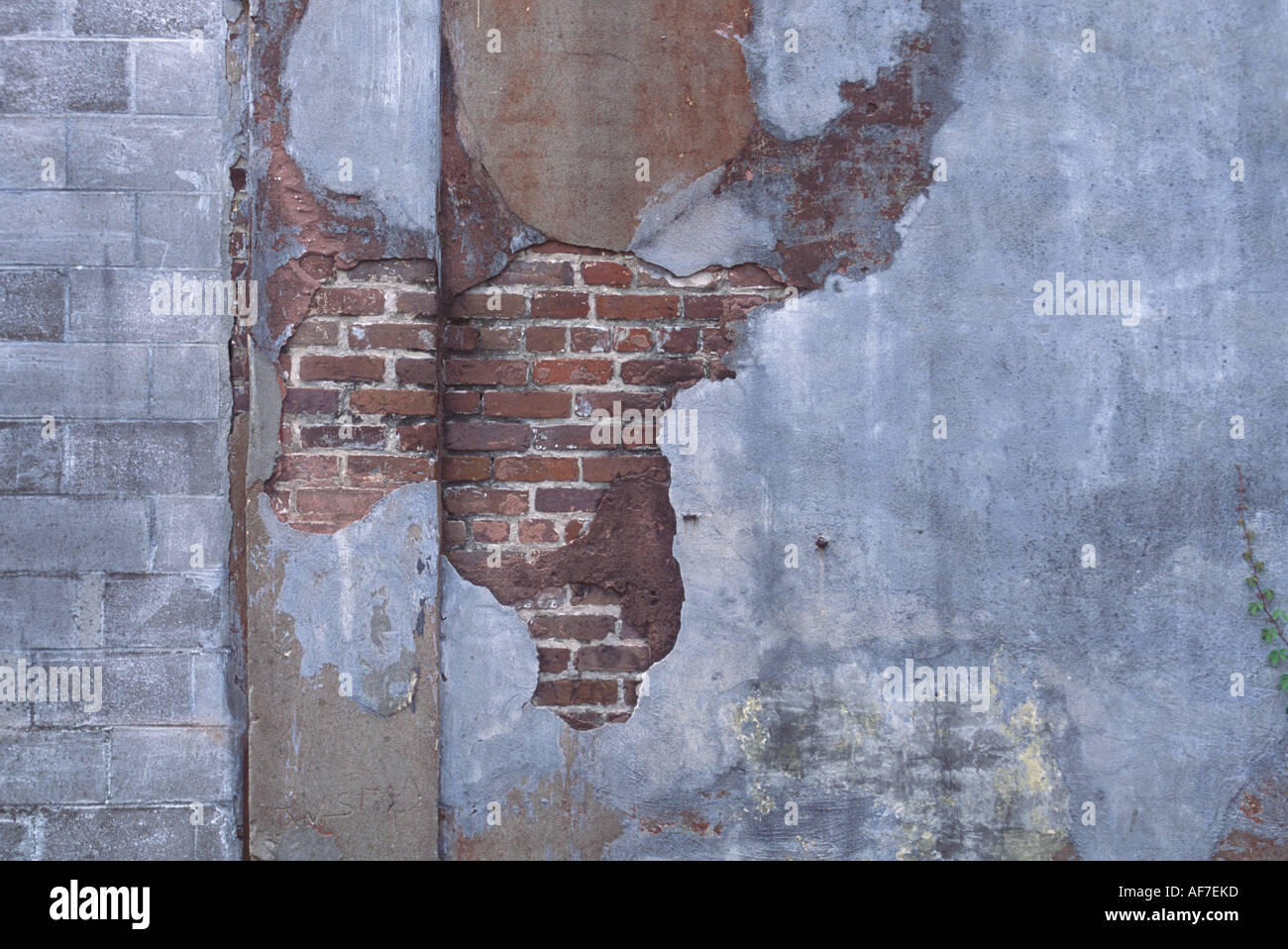Map-like quality of city wall, broken and exposed layers of brick and ...