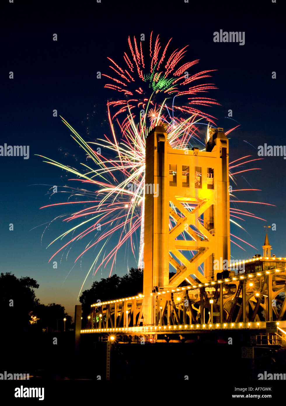 Fourth of July fireworks exploded behind the tower bridge in Sacramento